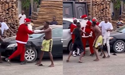 Residents intervene as Father Christmas fights agbero on the street (Video) - father christmas fight tout 1