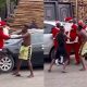 Residents intervene as Father Christmas fights agbero on the street (Video) - father christmas fight tout 1