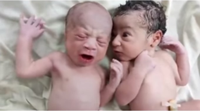 Funny moment newborn baby 'expressed shock' while watching his twin brother cry loudly (Video) - newborn twin brother cry 1