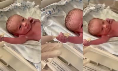 Funny reactions as newborn baby holds doctor's hand and refuses to let go (Video) - newborn baby hold doctor gloves 1