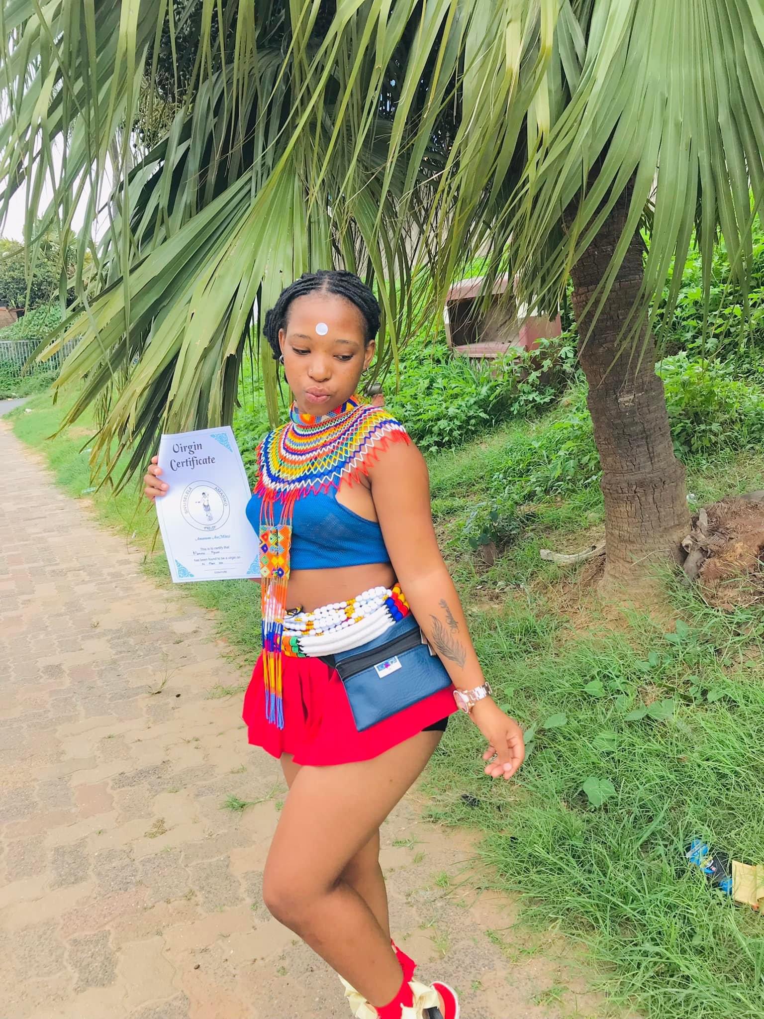 Beautiful lady proudly flaunts her certificate of virginity - lady virginity3
