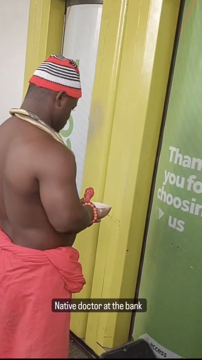 Native doctor storms bank with juju to help customers gain access - native doctor bank 1