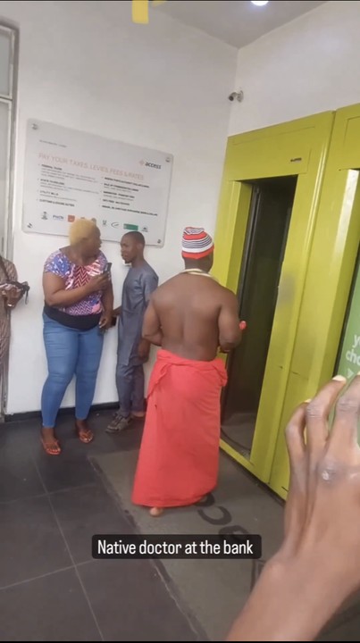 Native doctor storms bank with juju to help customers gain access - native doctor bank 3