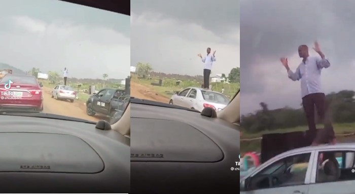 Soldiers punish man by making him stand on his car to wave at motorists (Video)
